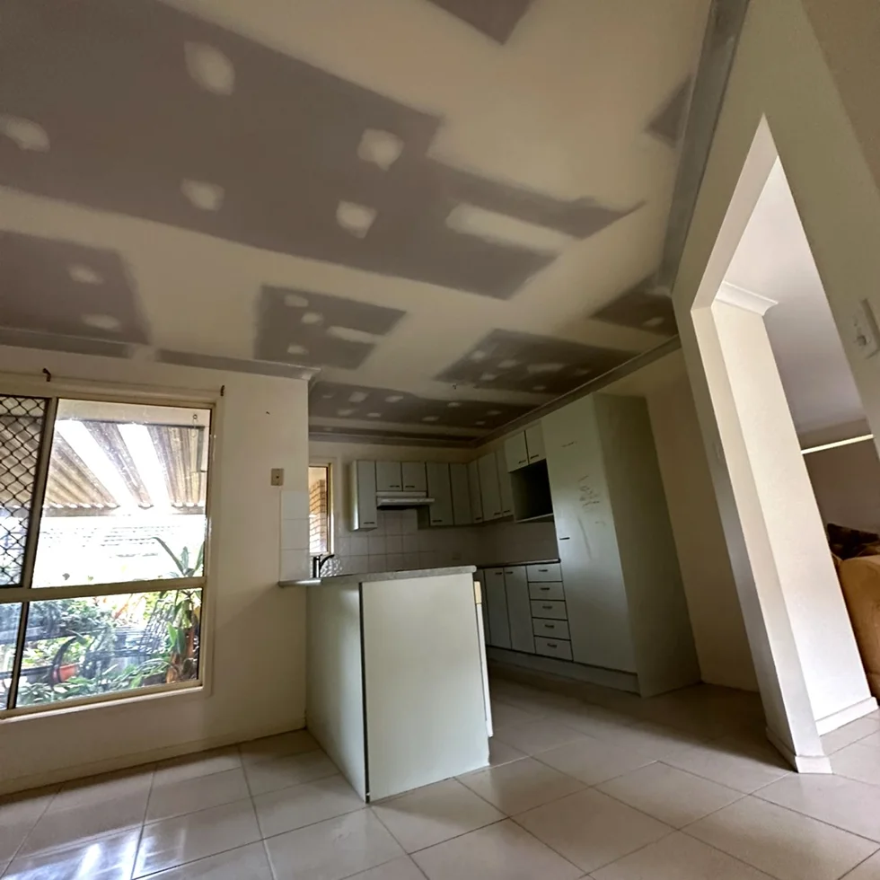Ceiling sanding process smoothing plaster surface